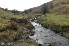 31. Flowing below Pig Hill
