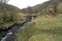 32. Flowing below Pig Hill
