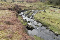 42. Flowing below Pig Hill